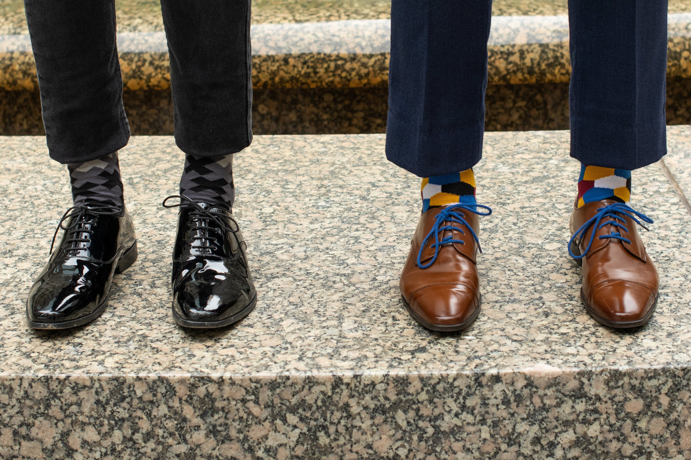 two people wearing dress socks and dress shoes side by side